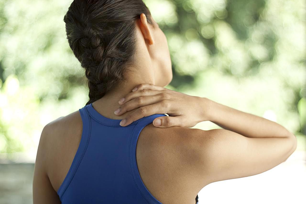 Young woman in sportswear with neck pain. You may also like: