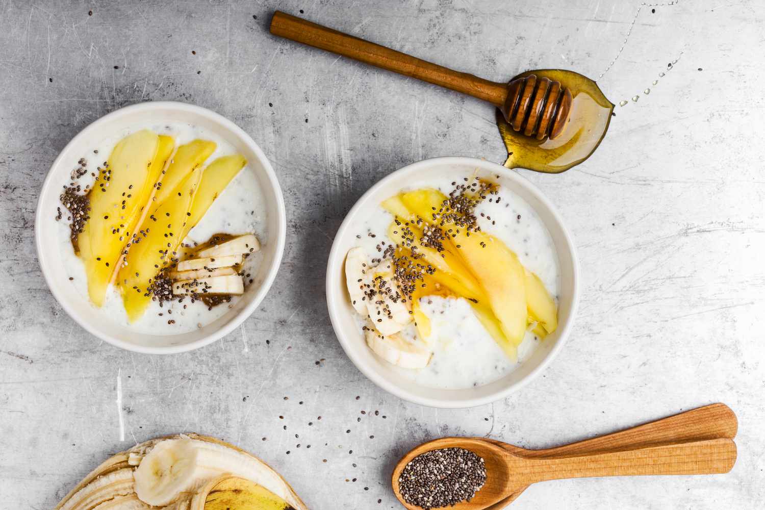 Greek yogurt bowls with mango, banana, chia seeds, and honey