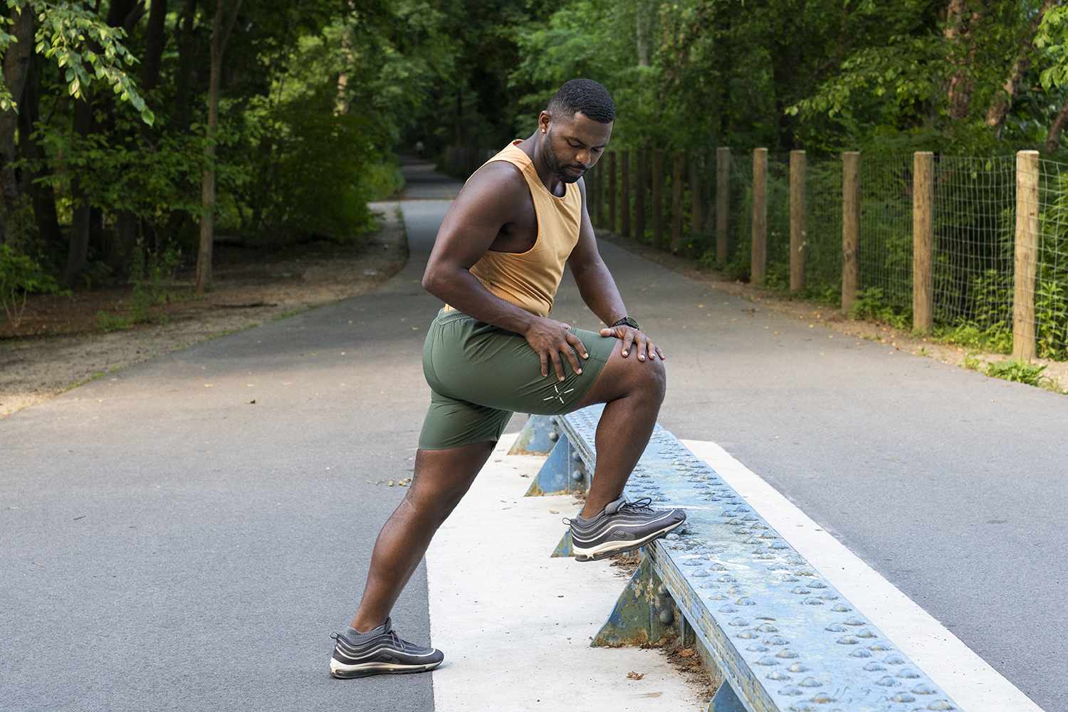 man stretching on a bench