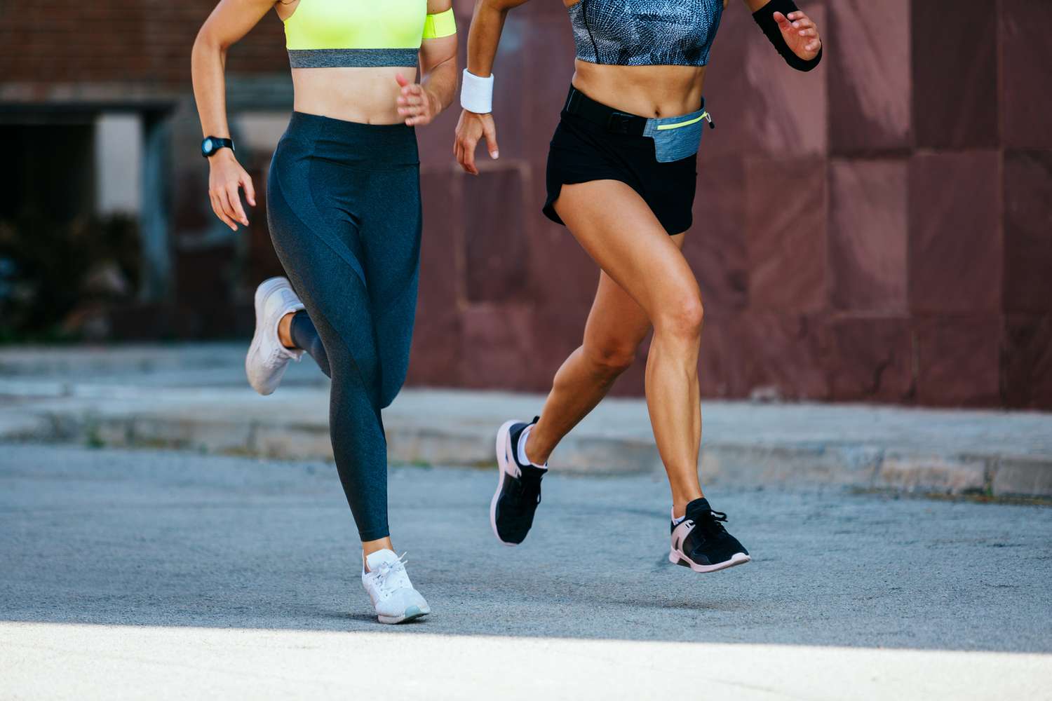 the lower half of two women running or training for a race