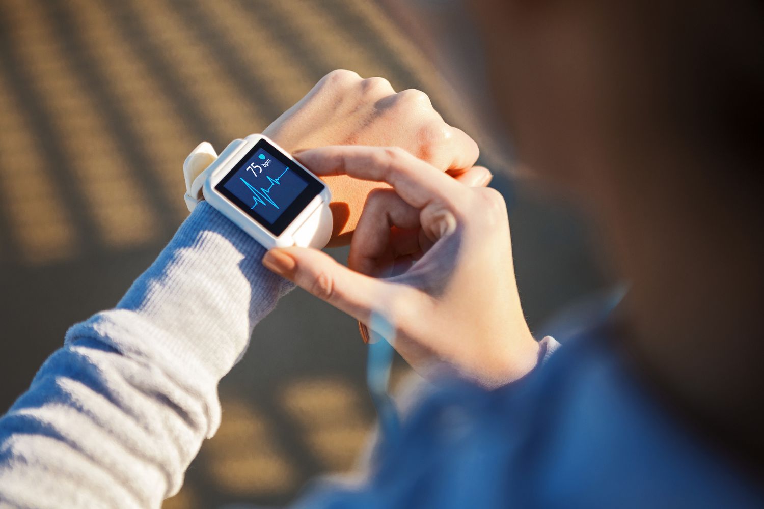 Woman checking her heart rate on smart watch