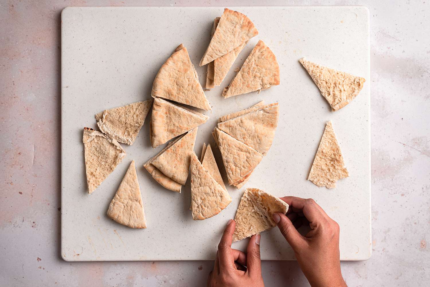 Pita bread cut into pieces and separated in half