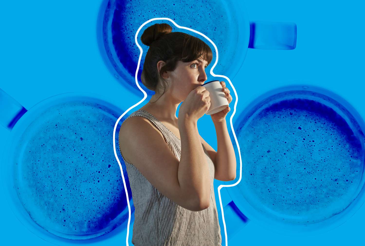 woman in tank top drinking a hot cup of coffee