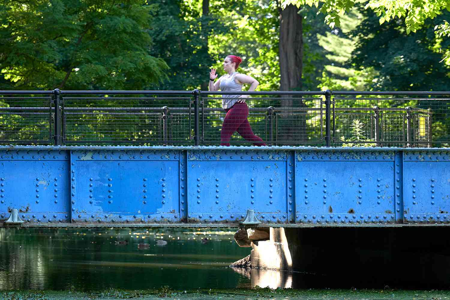 Woman running on a bridge