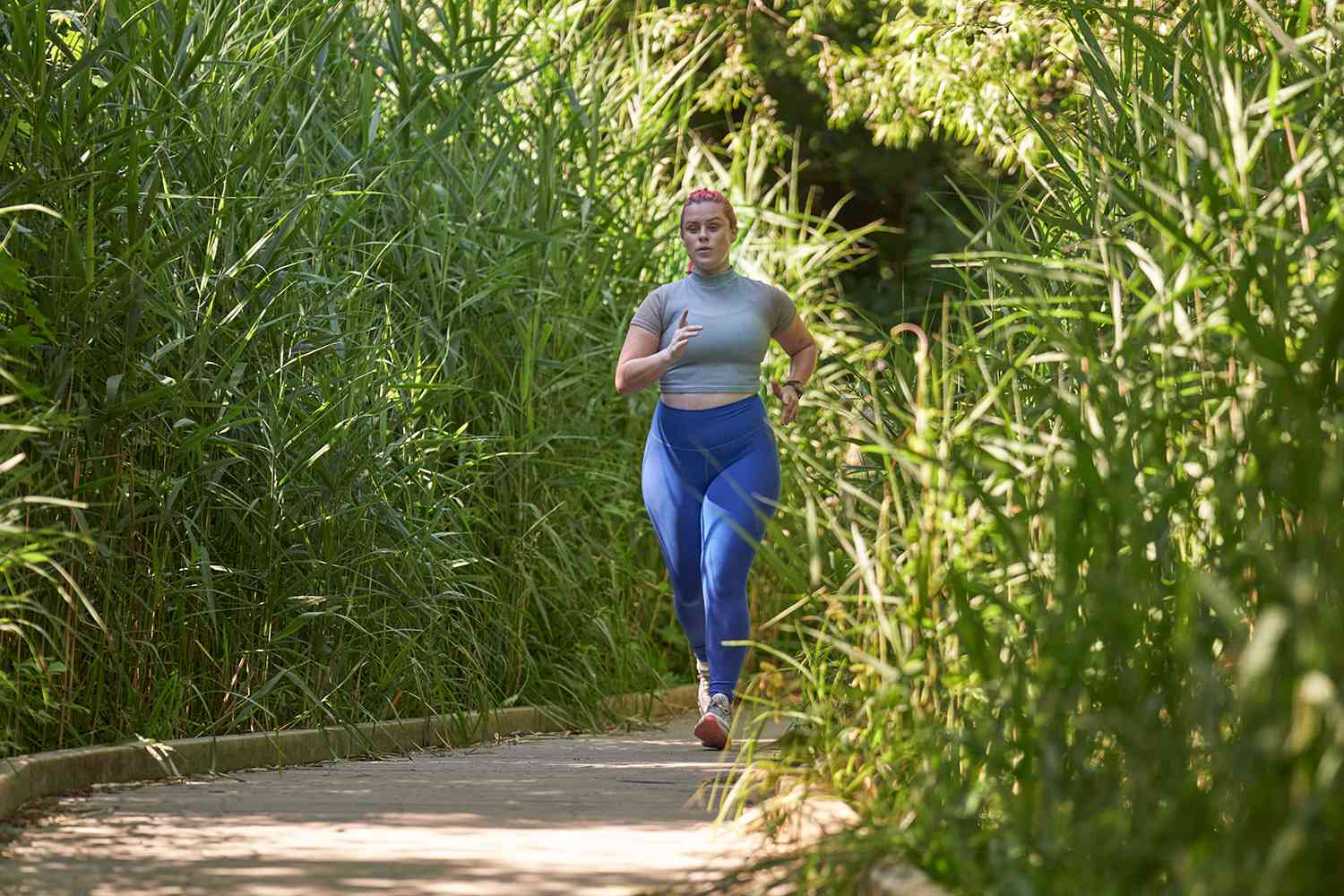 woman running on trail in park