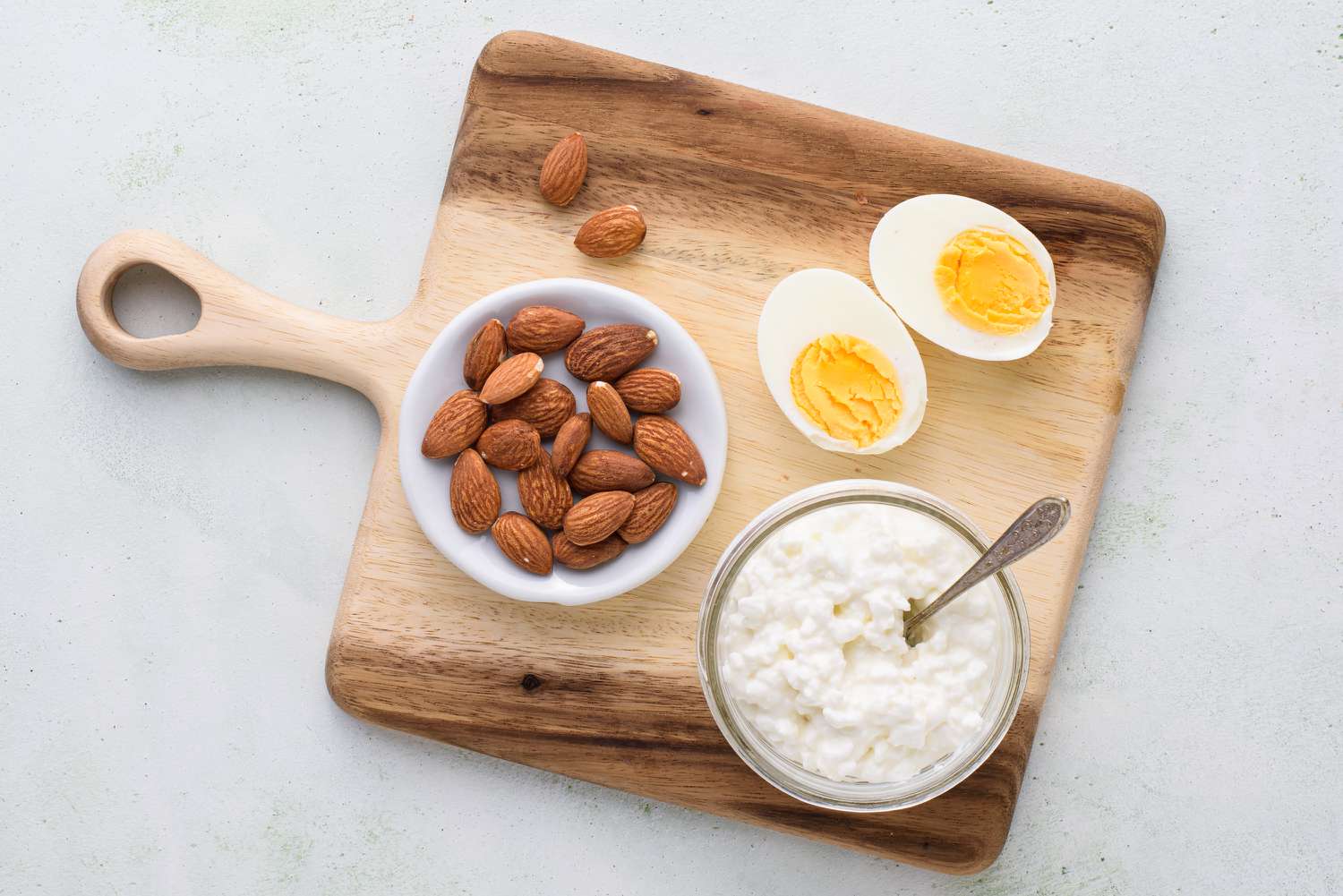 group of protein sources including eggs, almonds, and cottage cheese