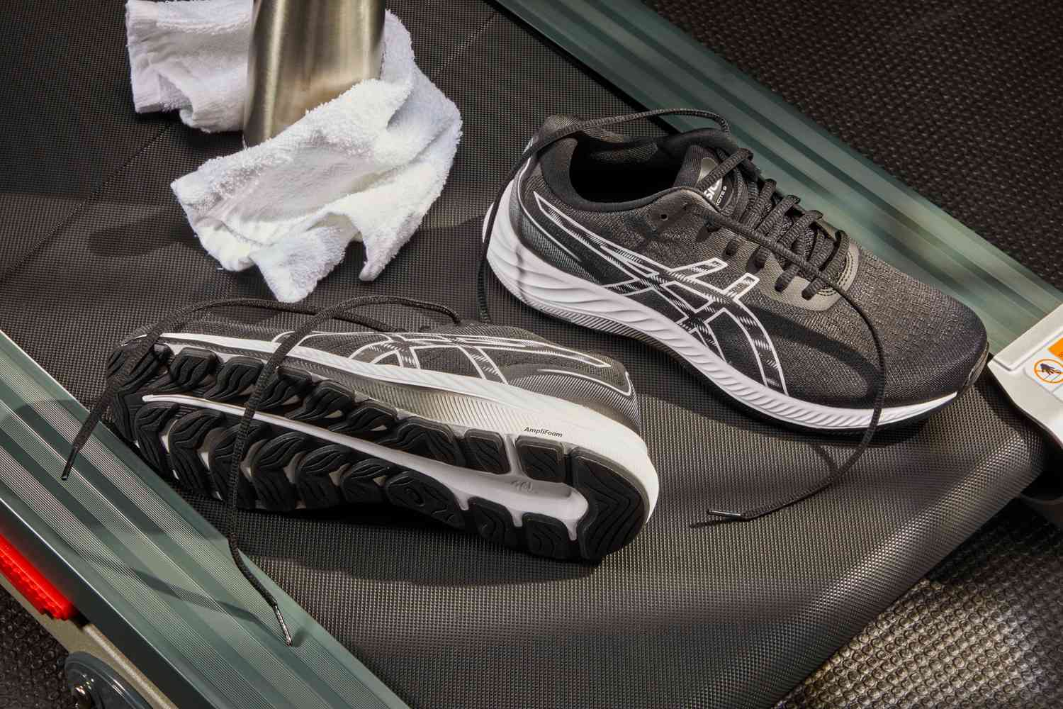 Asics Gel-Excite 9 Women's Running Shoe displayed on treadmill with a towel