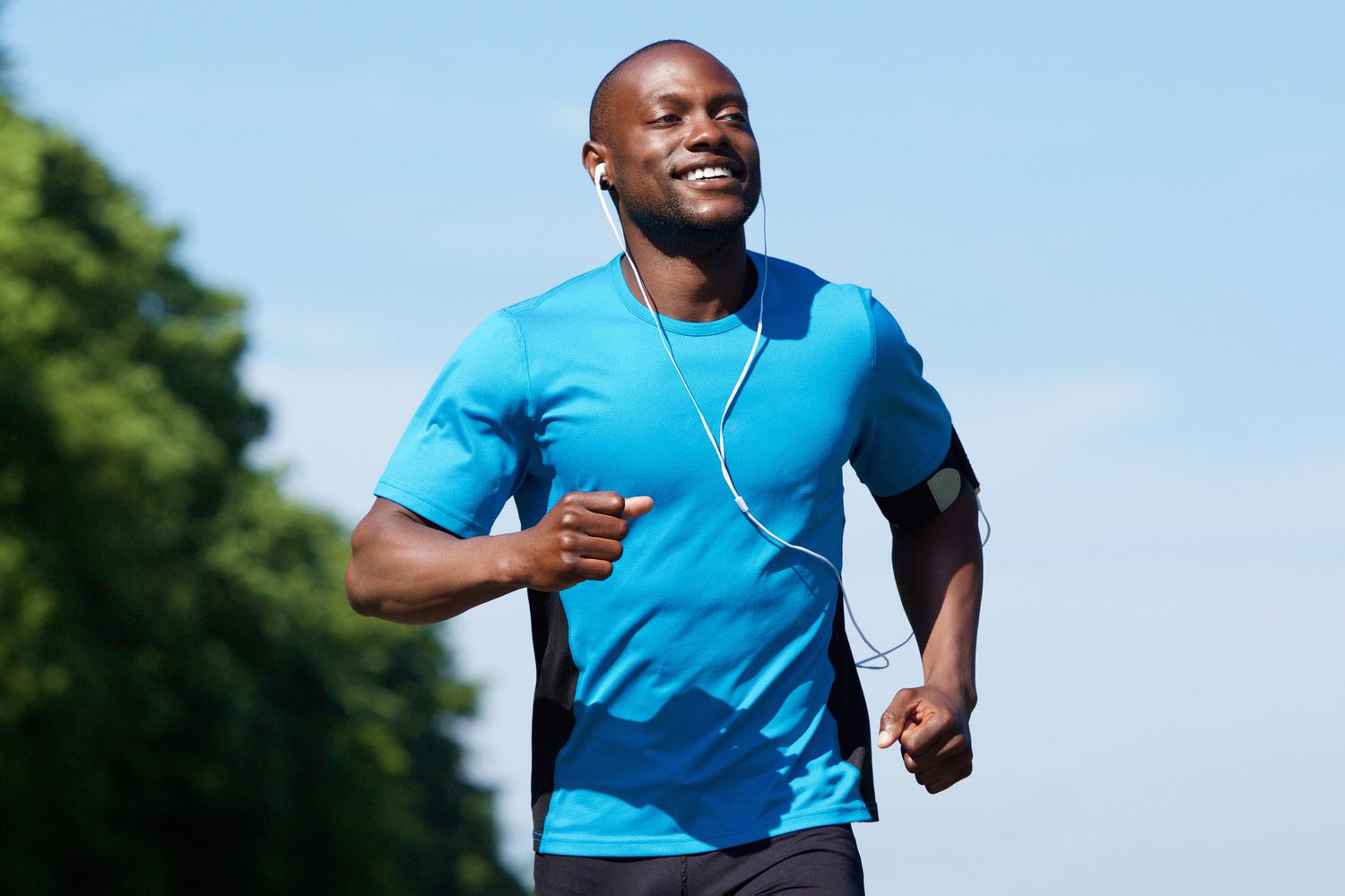 Portrait of an active African American man running exercise workout outdoors