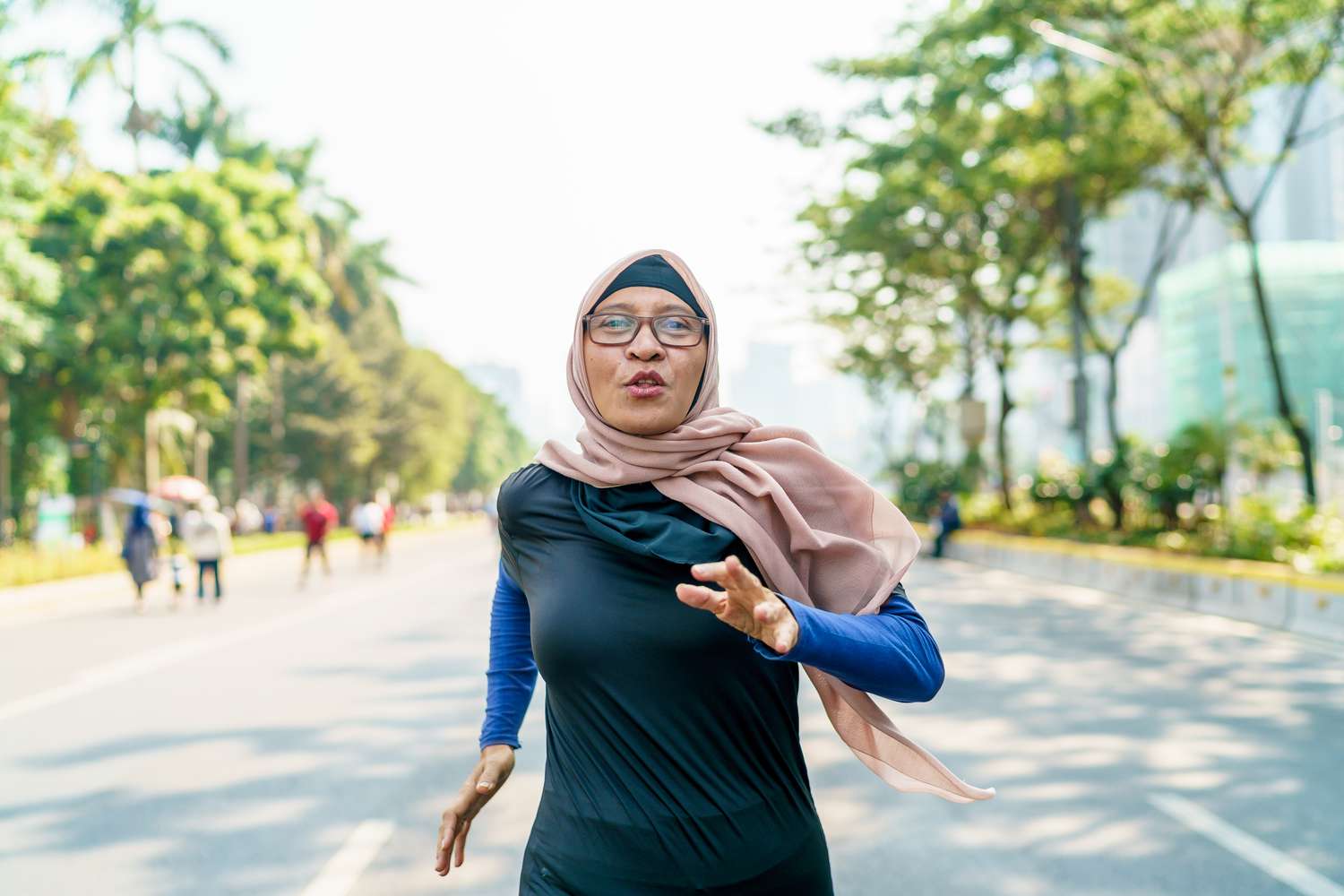 Woman in head scarf running