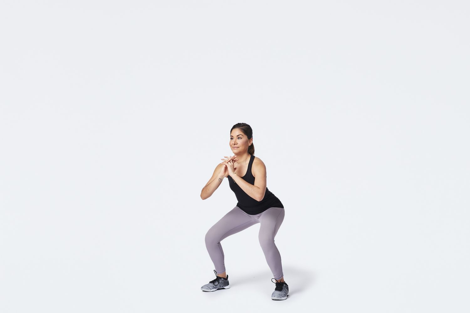 woman performing a squat