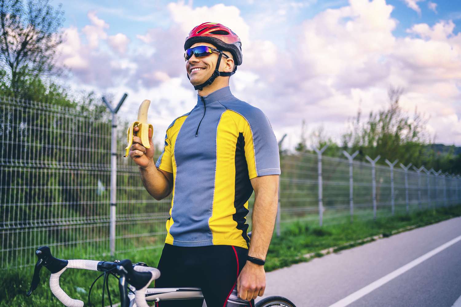 Cyclist eating a banana