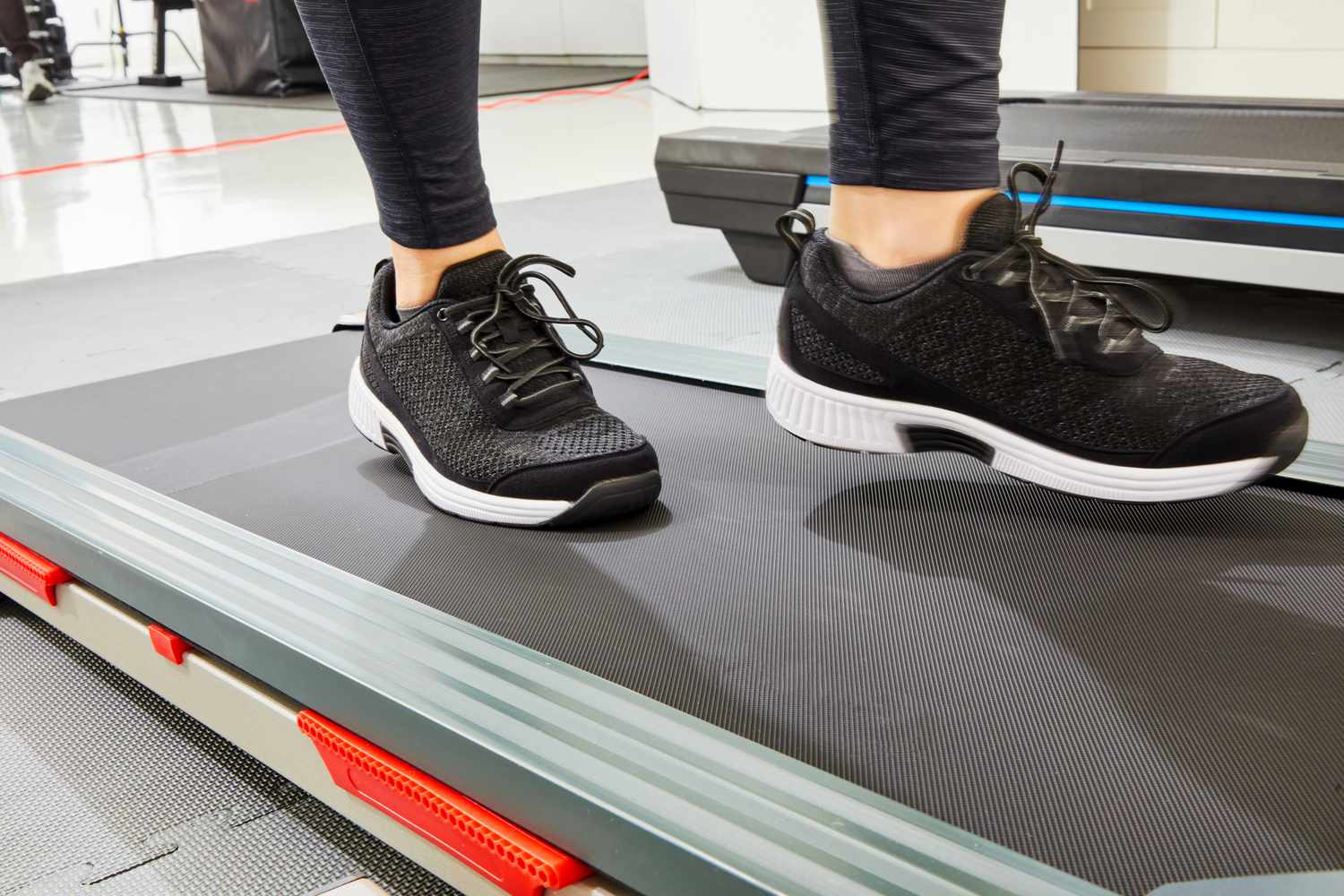 Closeup of person wearing Orthofeet Edgewater Athletic Shoes on a treadmill
