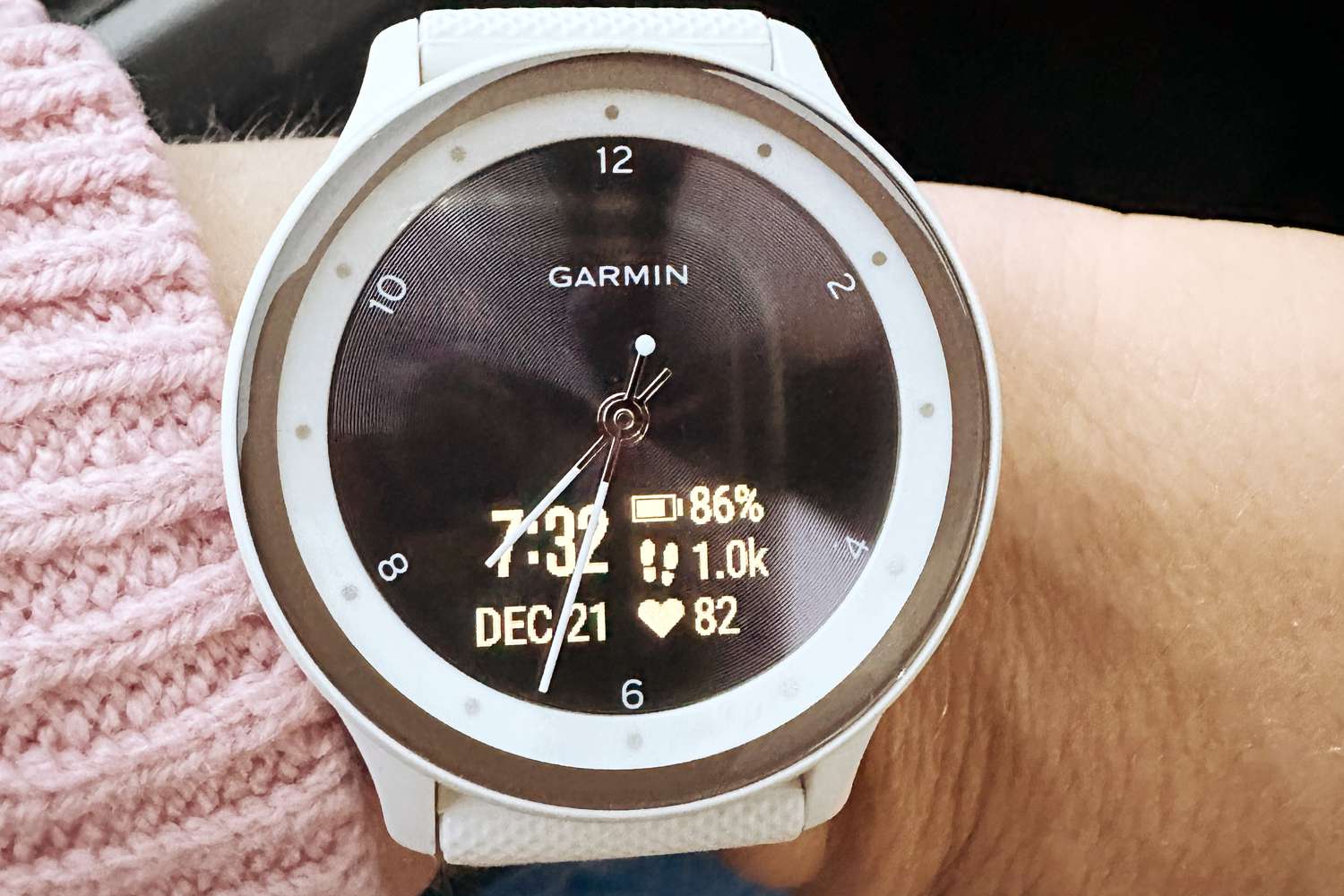 Close up of a person wearing the Garmin Vivomove Sport Watch