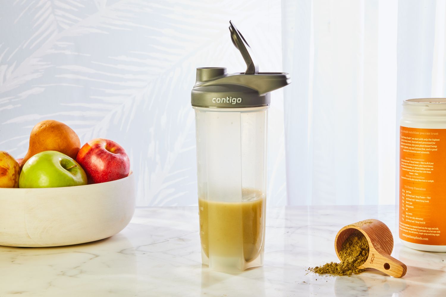 Contigo Shake & Go Thermalock Bottle displayed with smoothie, scoop, and fruit